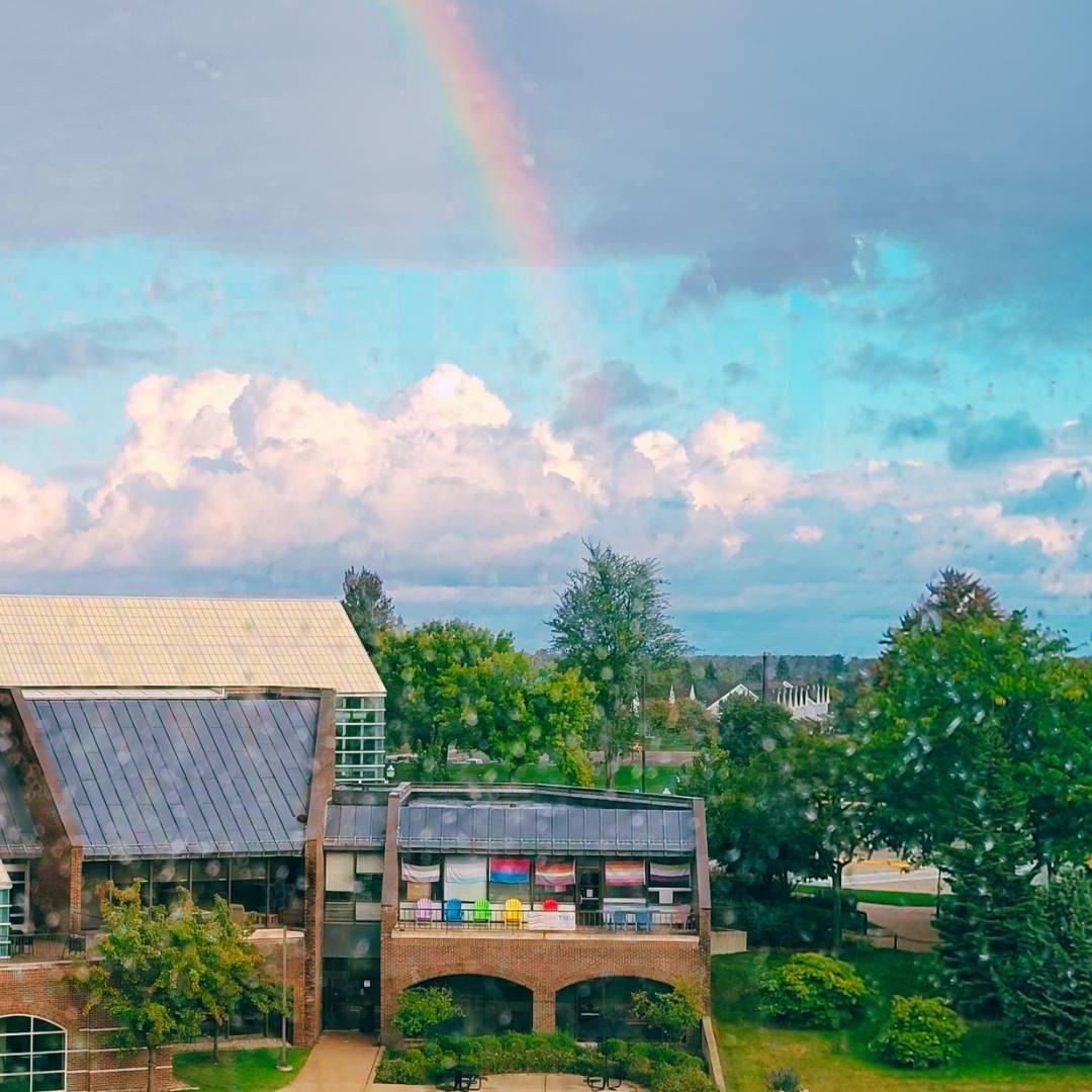 LGBTRC with rainbow in the rain